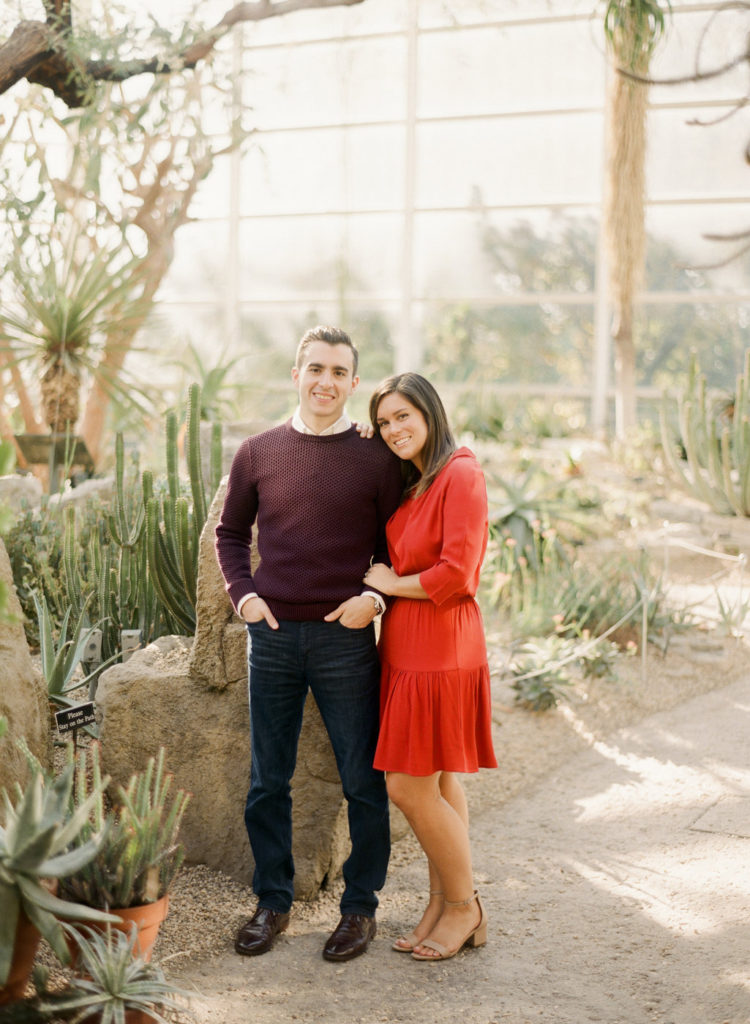 A couple posing inside the Desert Pavilion at Brooklyn Botanic Garden during romantic engagement photos NYC with You Look Lovely Photography