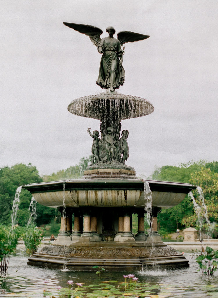 The Angel of the Waters statue atop Bethesda Fountain in Central Park photographed by You Look Lovely Photography during NYC engagement photos