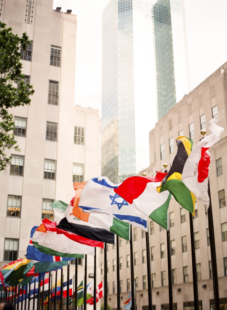 Waving flags of the world displayed at Rockefeller Center, NYC photographed by You Look Lovely Photography