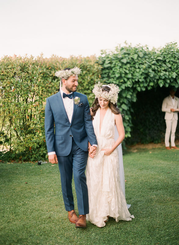 Couple wearing floral crowns for a greek ceremony during their destination wedding at a tuscan villa photographed by You Look Lovely Photography