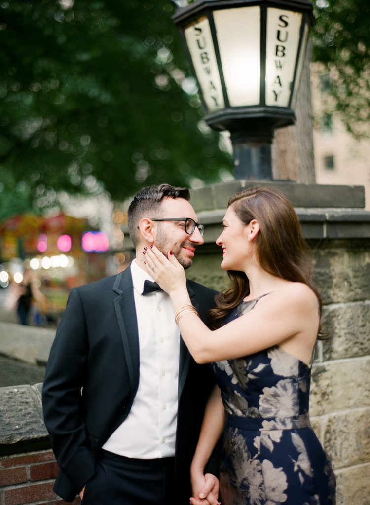 NYC engagement photos in front of a subway station photographed by You Look Lovely Photography