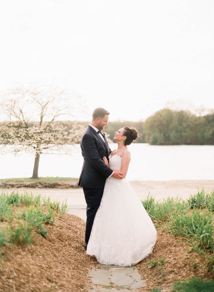 A couple embrace during sunset at the Indian Trail Club in New Jersey photographed by You Look Lovely Photography