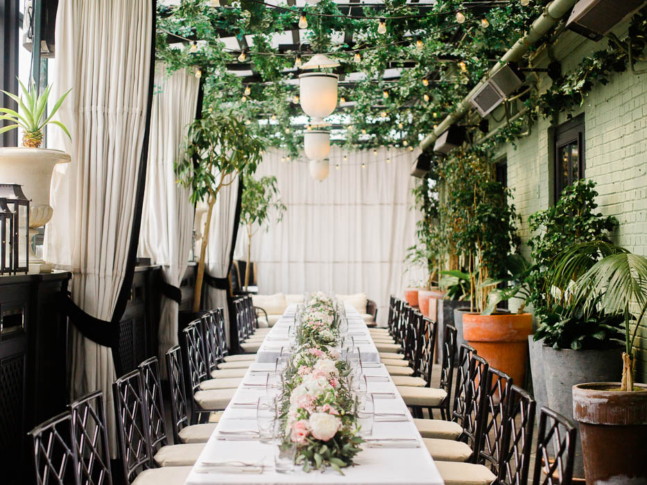 Wedding reception at Gramercy Park Hotel featuring a long table and lush greenery photographed by You Look Lovely Photography