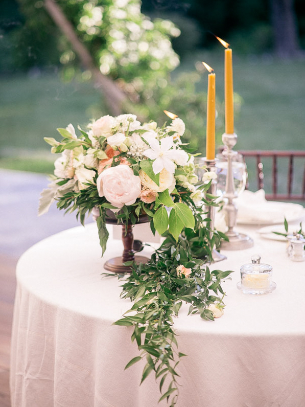 Romantic floral centerpiece at a private estate wedding photographed by You Look Lovely Photography