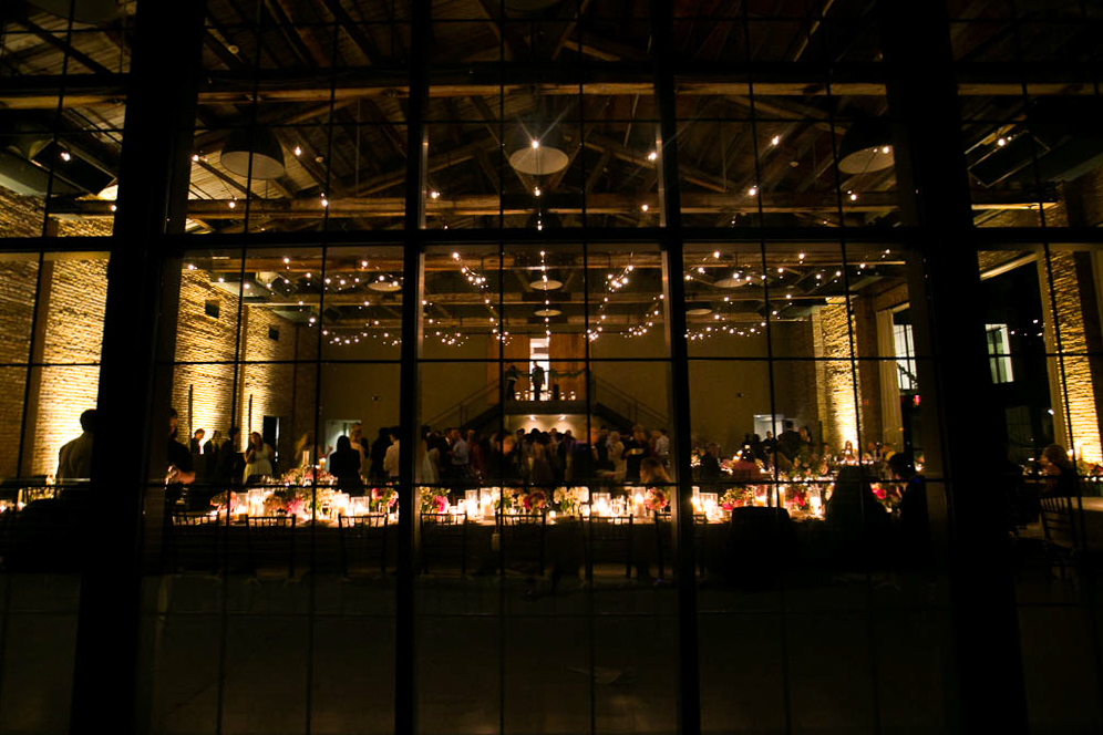 A photograph of a wedding reception from the outside of the Roundhouse in Beacon NY photographed by You Look Lovely Photography