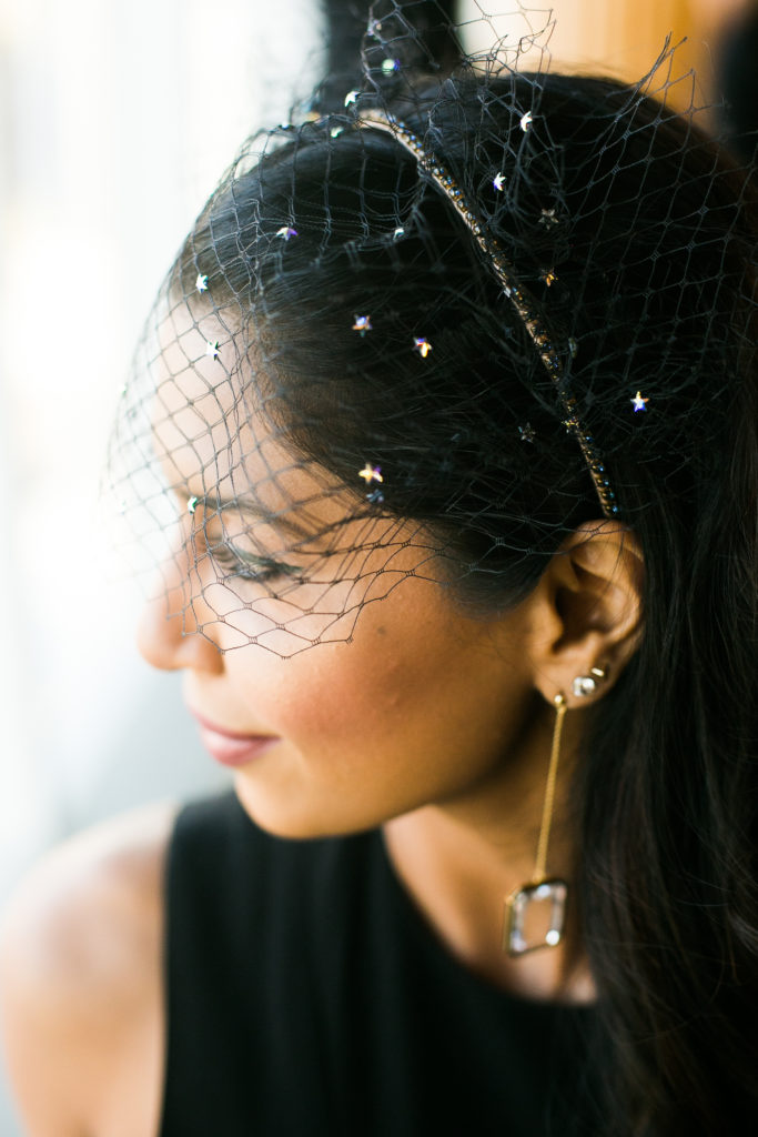 Portrait of a stylish wedding guest wearing a fascinator photographed by You Look Lovely Photography