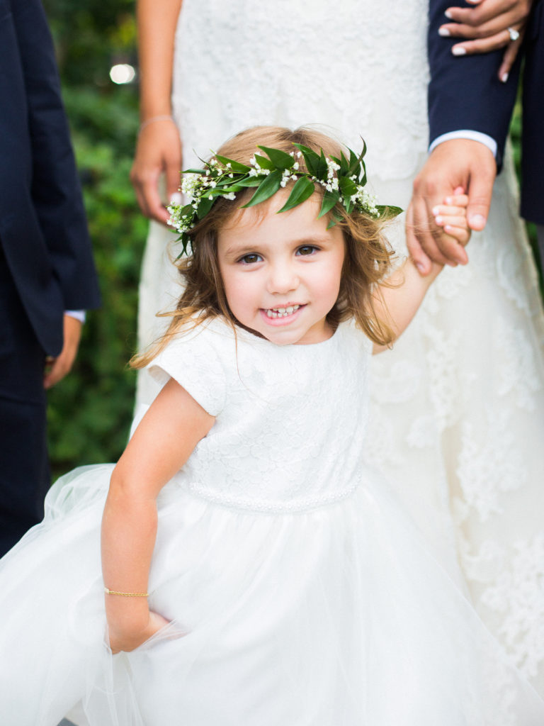 Flower girl wearing a floral crown at a wedding at the Roundhouse photographed by You Look Lovely Photography
