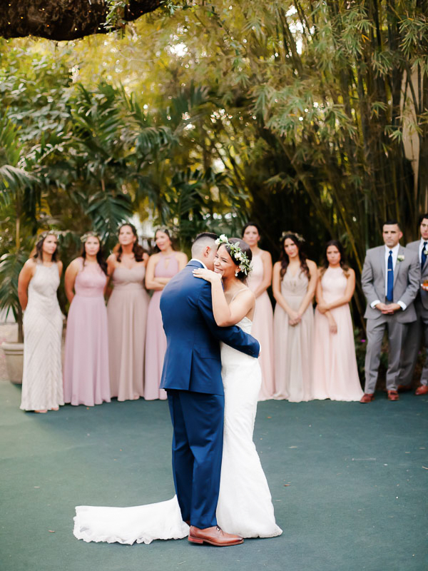 Bride and groom share their first dance during their outdoor wedding at Villa Woodbine in Miami photographed by You Look Lovely Photography 